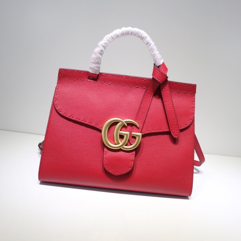G*u*i top handle bags